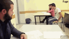 a group of people are sitting at desks in a classroom with fuga written on the bottom right