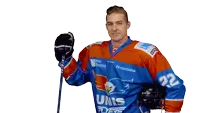 a hockey player wearing a blue and orange jersey that says unis