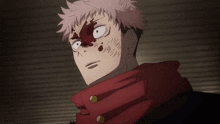 a close up of a person with blood on their face