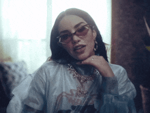 a woman wearing sunglasses and a shirt that says sky walker
