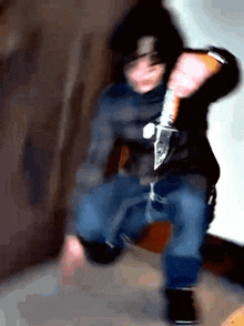 a blurry picture of a man holding a knife