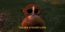 a cartoon lemur is saying `` you are a loved cutie '' in a field of flowers .
