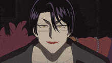 a man with glasses and a red lip is looking at the camera