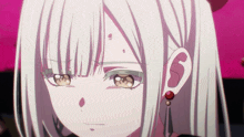 a close up of a girl 's face with a red earring