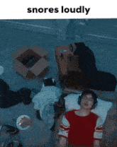 a man wearing headphones is sleeping on a couch in a room with the words snores loudly above him