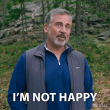 a man wearing a vest that says patagonia on it