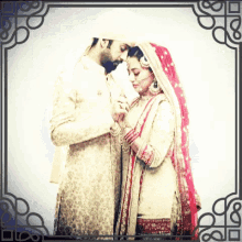 a picture of a bride and groom holding hands with a fancy frame around them
