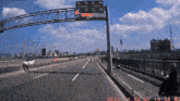 a sign on the side of a highway that says wow ishout