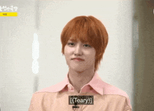a man with red hair is making a funny face and the word teary is on the bottom