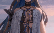 a close up of a woman 's torso with a blue and black floral design