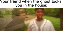a man and a woman are standing next to each other in front of a house .