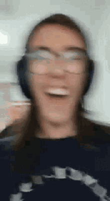 a blurry picture of a person wearing headphones
