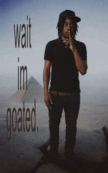 a man stands in front of a pyramid with the words wait im goated