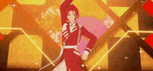 a man in a red suit is dancing on a stage in front of a yellow background .