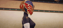 a woman wearing a mask with wings on it