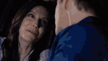 a man and a woman are looking into each other 's eyes with the letters vb on the bottom right