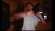 a blurry picture of a man in a striped shirt dancing