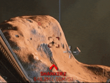 a screenshot of a video game shows a mountain with a red arrow pointing to the top