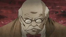 a bald man with glasses and a mustache is looking at the camera