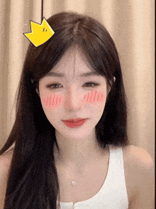 a girl with a yellow crown on her head looks at the camera