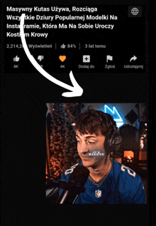 a screen shot of a man wearing headphones and a massive logo