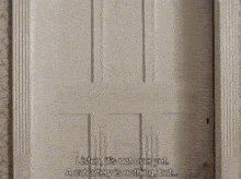 a white door with a quote on it that says listen it 's not over yet
