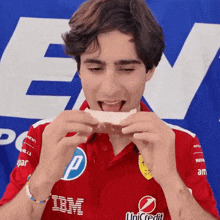 a man wearing a red shirt with ibm on it