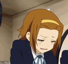 a brown haired anime girl with a yellow headband