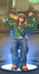 a woman in a green sweater is sitting in a chair with her arms outstretched .