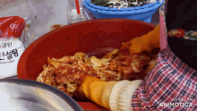 a bag of white sugar sits next to a large bowl of food