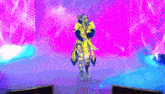 a woman in a yellow and blue outfit is standing on a stage with a purple background