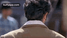 the back of a man 's head is shown in a close up of a movie scene .