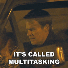 a man driving a car with the words it 's called multitasking