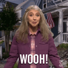 a woman wearing a purple jacket says wooh