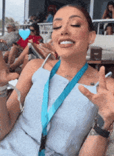 a woman with a lanyard around her neck that says ' i love you '