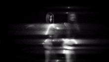 a blurry picture of two people standing next to each other behind a glass .