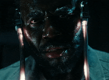 a close up of a man 's face with headphones on and the word kenter on the bottom right