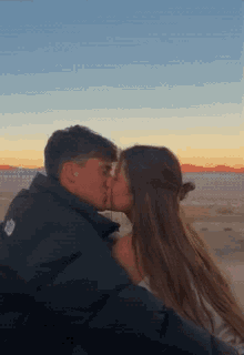 couple kiss hug sunset happy