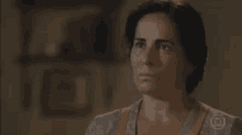 a woman is making a funny face in a room .