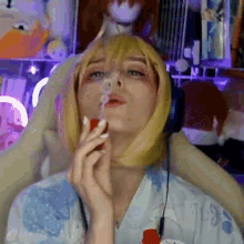 a woman in a wig is blowing soap bubbles in a room .