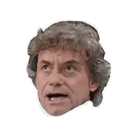 a close up of a man 's face with a sticker on it