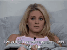 a blonde woman is laying in bed with the words " i wish that i cared more about this but i don 't "