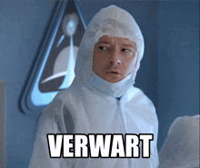 a man in a protective suit has the word verwart on his face