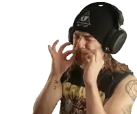 a man wearing headphones and a beanie with an all seeing eye