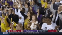 a crowd of people watching a game between lsu and alabama on cbs sports