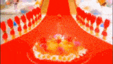a cake on a red carpet that says coca cola