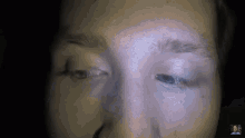 a close up of a person 's eyes with a man 's face in the corner