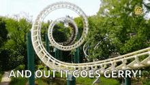 a roller coaster in a theme park with the words `` and out it goes gerry '' written on it .