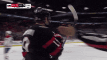 a hockey game is being played with a score of 3 to 2