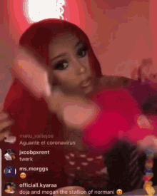 a woman with red hair and a pink shirt is being viewed by a group of people